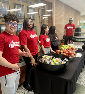 A photo of Red Squad volunteers serving free breakfast.