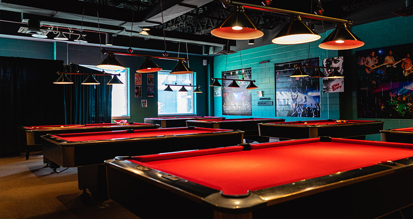 A photo of several pool tables.