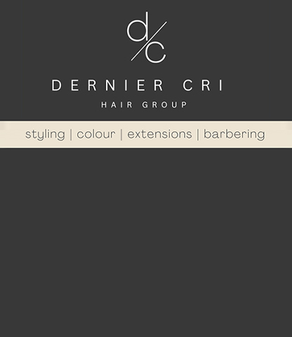 The interior of Dernier CRI Hair Group at Fanshawe College. Chairs, a table and shelving is shown.